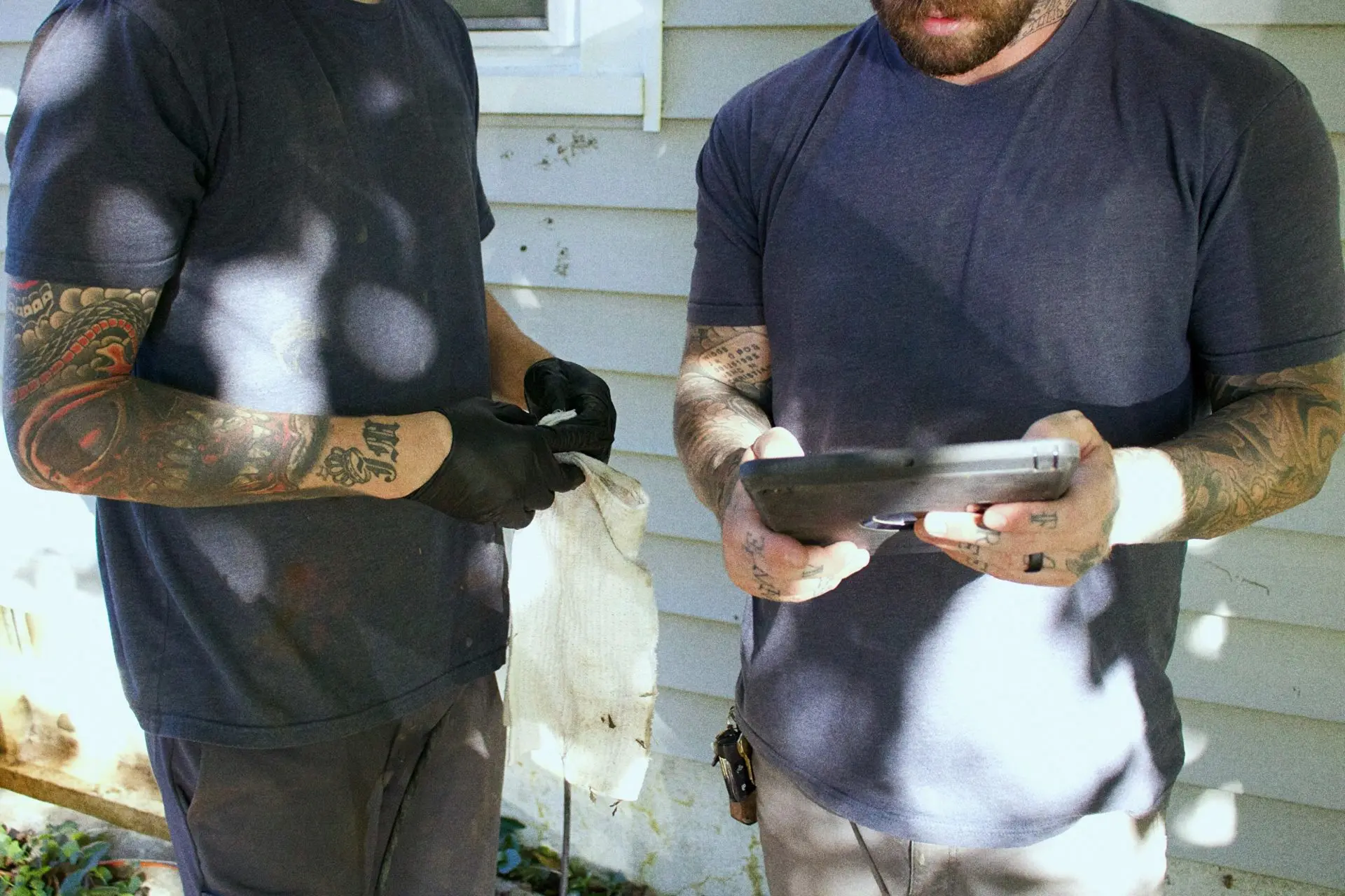Reliable Plumbing Services | men on tablet